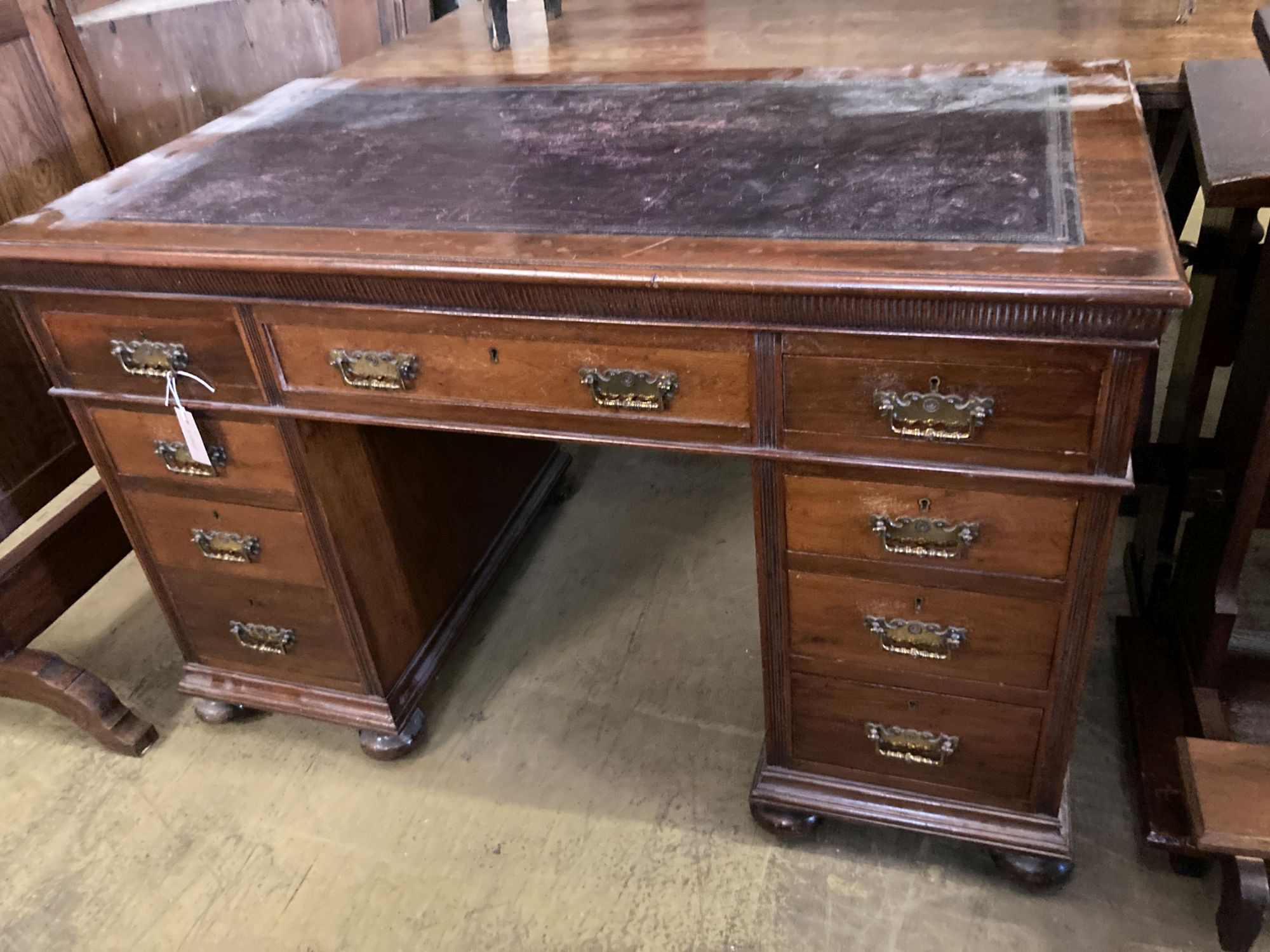 A late Victorian walnut pedestal desk, length 122cm, depth 67cm, height 77cm